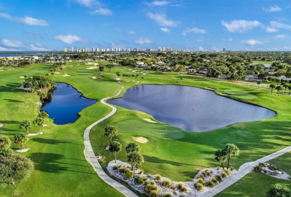 Manicured golf course fairways with water features