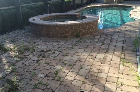 Dirty pool deck pavers before professional cleaning showing stains and deterioration