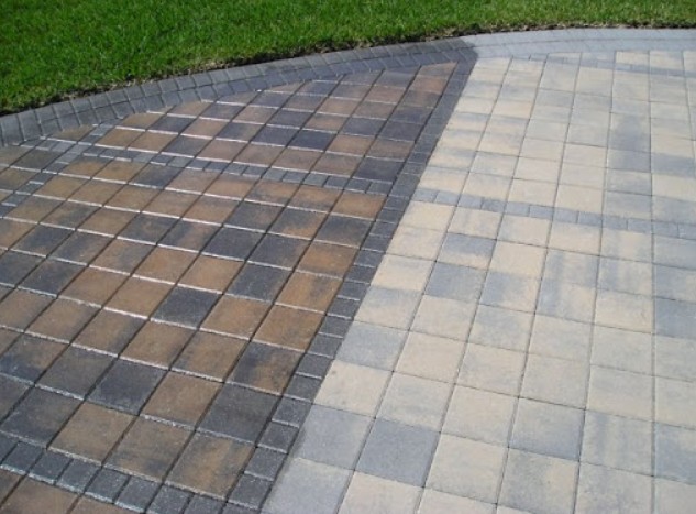 Beautifully restored patio with geometric paver pattern after professional sealing