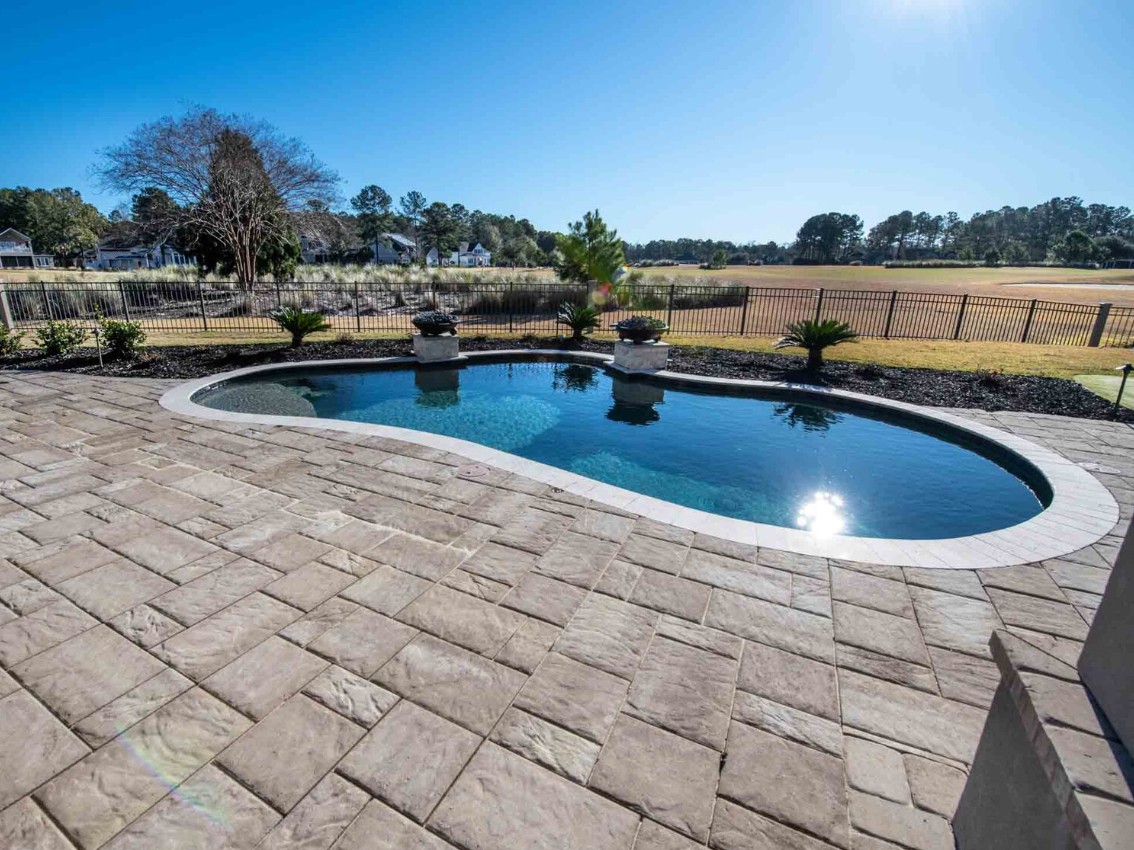 Oval Pool with Natural Stone Deck - Curved Design Specialty