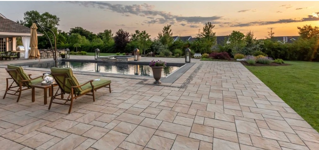 Luxury Natural Stone Pool Deck with Outdoor Furniture - Florida