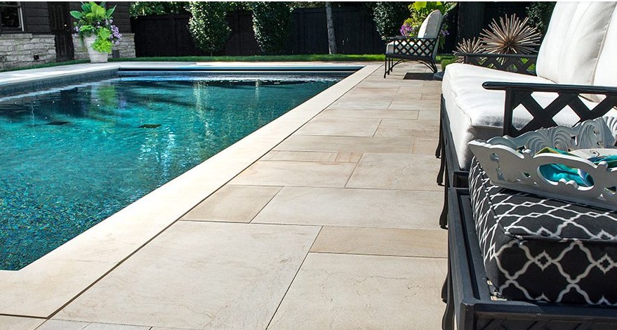 Natural Stone Pool Deck with Outdoor Seating - Elegant Design