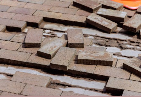 Paver repair work in progress showing professional restoration techniques and quality materials